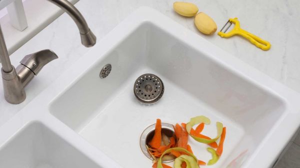how often to clean garbage disposal, vegetable scraps in kitchen sink